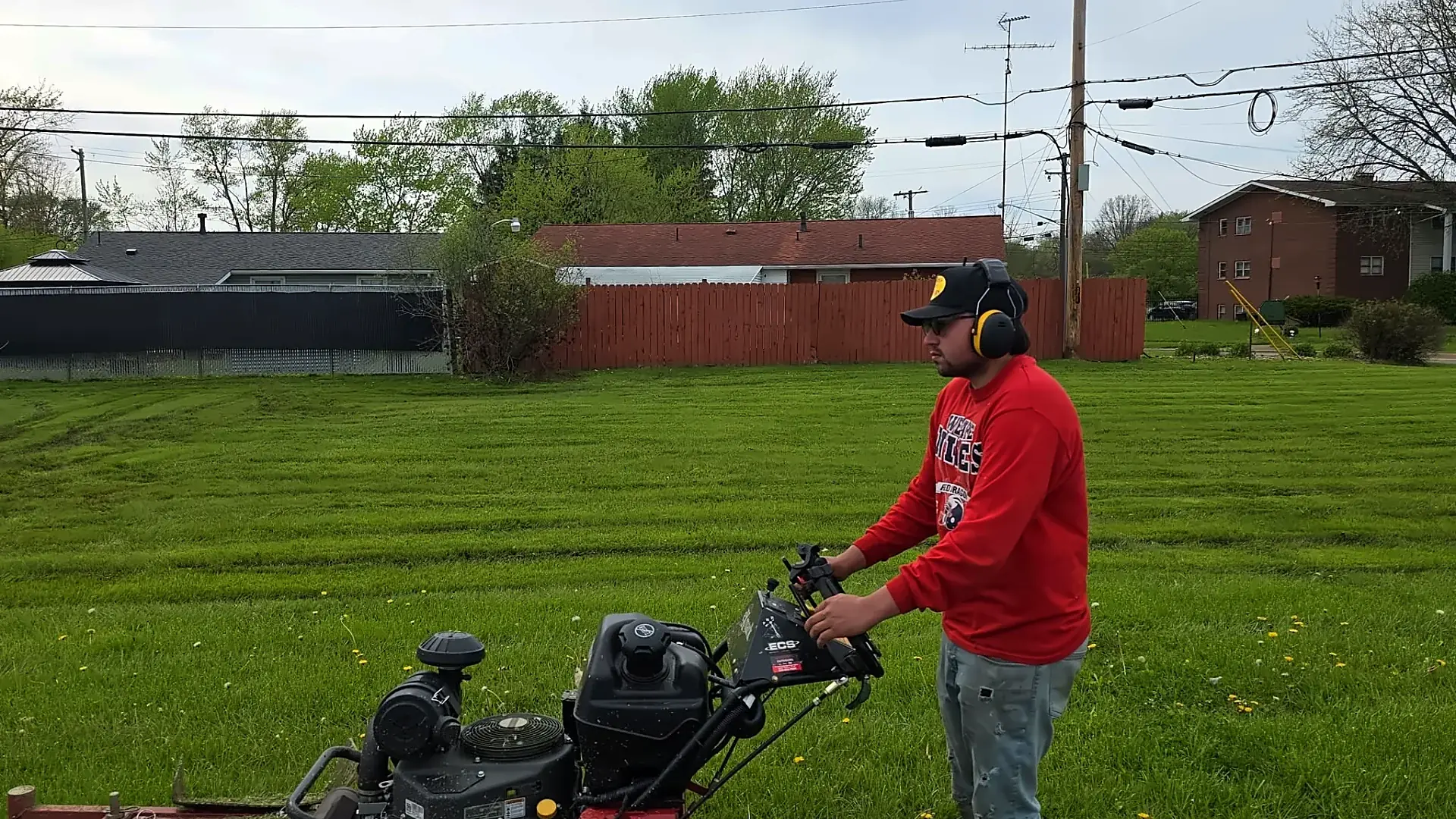 A&L Lawn Care crew mowing a lawn in Ohio